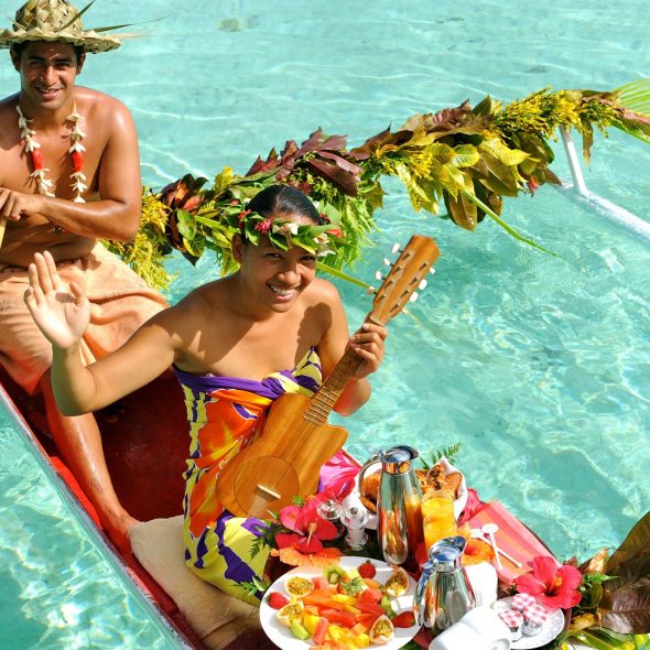 Breakfast in bed delivered on a canoe, in Bora Bora