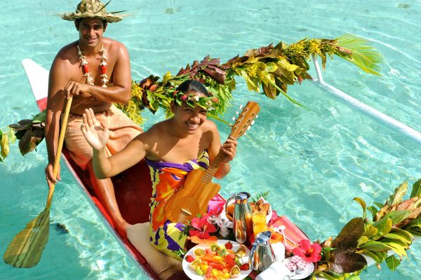 Breakfast in bed delivered on a canoe, in Bora Bora